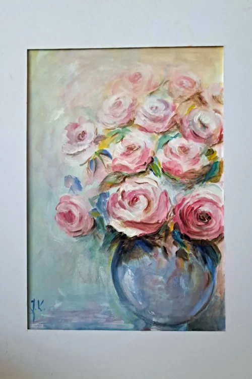 Róże w szklanym wazonie